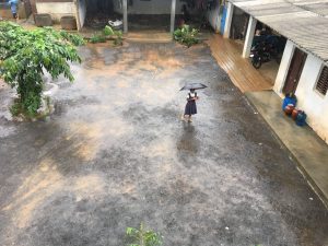 Girl in mud and rain
